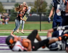 Scotland stat girls sophomore Elyssa Walloch, left, and Taylor Bietz, sophomore,cheer as Scotland's Tanner Iwan (7) scores the game winning touchdown during a game on Friday at the University of Sioux Falls Sports Complex in Sioux Falls. (Matt Gade/Republic)