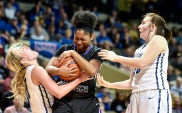 Dakota Wesleyan's Rylie Osthus (10) gets hit in the face fighting for a loose ball with Goshen College's Lynnia Noel (23) as Dakota Wesleyan's Kelsey Bertram (30) was also involved in the play during the third round of the NAIA Division II women's national tournament on Saturday at the Tyson Events Center in Sioux City, Iowa. (Matt Gade/Republic)
