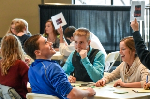 Mount Vernon's (from left) Emily Wieczorek, Kyle Koch, Joe Johnson and Ashley Glanzer celebrate a correct answer while competing in the Custer Battlefield Highway academic festival quiz bowl on Wednesday afternoon in the Sherman Center on Dakota Wesleyan University's campus. (Matt Gade/Republic)