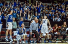 Dakota Wesleyan Head Coach Jason Christensen and the Tiger bench and fans celebrate a basket late during the first round of the NAIA Division II women's national tournament against Haskell Indian Nation University on Wednesday morning at the Tyson Events Center in Sioux City, Iowa. (Matt Gade/Republic)