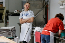 Sierra Messman has a laugh with Liza Plihal while cleaning the pans and trays after making the pastries on Friday, Jan 6. Sierra works part time in the mornings and is a senior at Bon Homme High School while Liza is the only other full time employee at the bakery beside Ed and Carol.