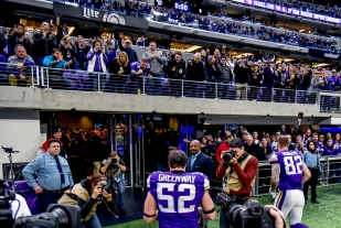 Minnesota Vikings' Chad Greenway (52) receives a roar of applause from the crowd as he walks back into the locker surrounded by the media following the Vikings win over the Chicago Bears in the final regular season game on Sunday at U.S. Bank Stadium in Minneapolis. Sunday's win over the Bears could be the 11-year-veteran's final game of his NFL career. Greenway said he will make a final decision about possible retirement before free agency.