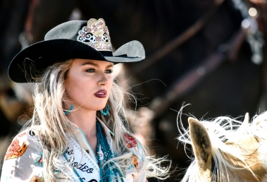 Junior Miss Rodeo South Dakota Adrianne Schaunaman, of Aberdeen, watches the action during the Wessington Springs Foothills Rodeo at the Jerauld County 4-H Grounds.