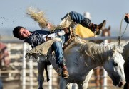 Jake Carmody, of Mobridge, does his best to hang on while competing in the bareback competition during the 28th Annual Burke Stampede Rodeo on Saturday night at the Burke, South Dakota Rodeo Arena in Burke.