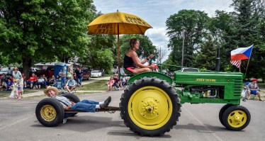 People line up across North Vyborny Street watching as parade floats go on by as part of the 69th Annual Czech Days parade on Friday in Tabor.
